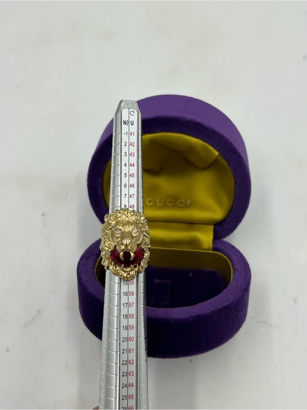Unisex, Gucci, gold tone prominent lion head motif with red crystal size 6 Italy